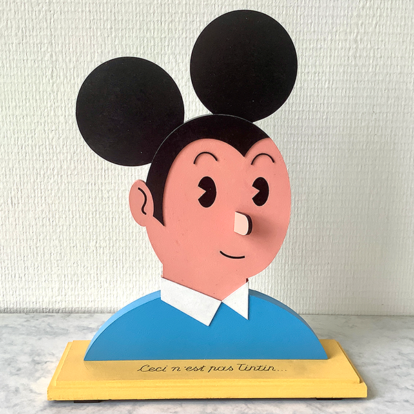 wooden sculpture of Mickey mouse and Tintin